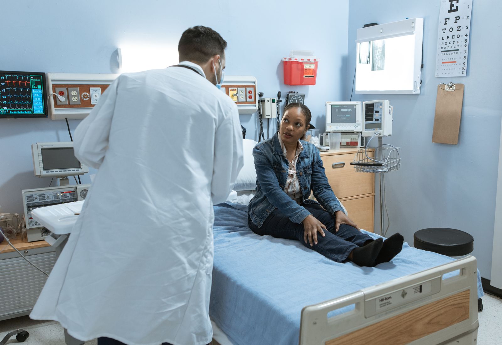 Doctor and patient having an unhurried conversation in a bright office